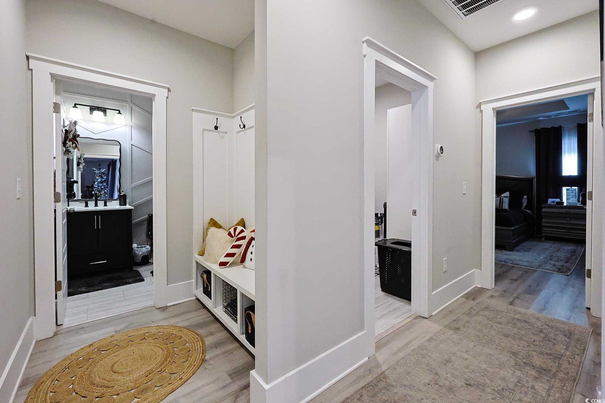 669 Pacific Commons Drive Surfside Beach, SC 29575 - Photo 8 of 36 Mudroom featuring light wood-type flooring and baseboards