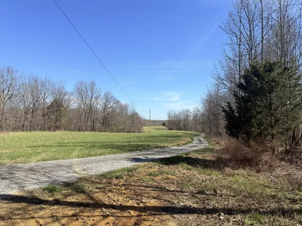 a kitchen with stainless steel appliances a stove a refrigerator and a dining table