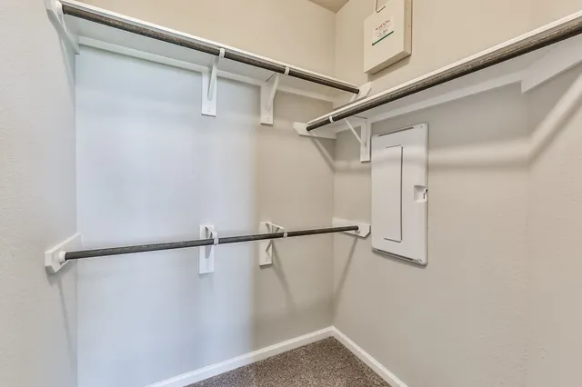 an empty room with closet area