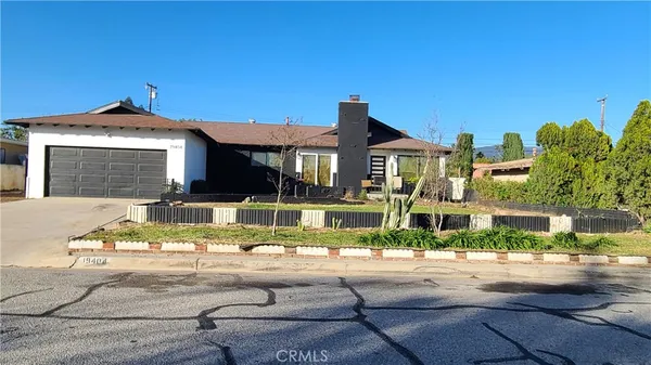 a view of a house with a swimming pool