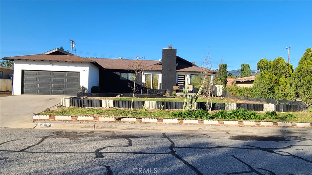 19404 Cheshire Street Rialto, CA 92377 - Photo 1 of 30 a view of a house with a swimming pool