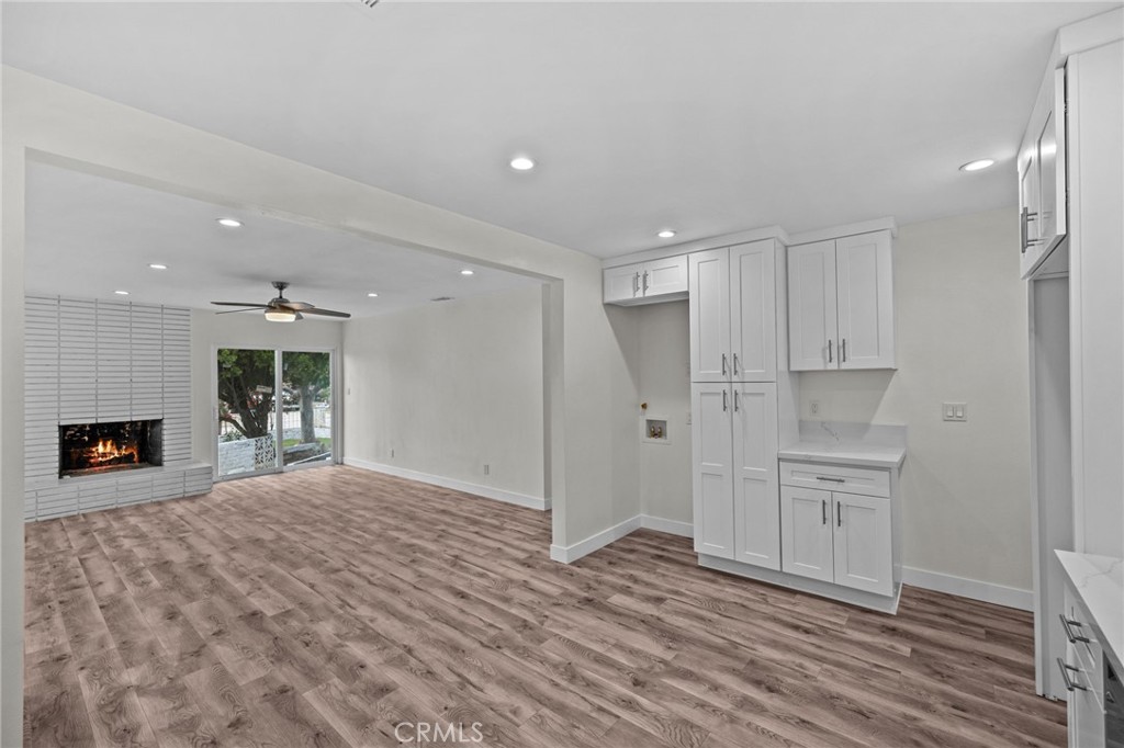 19404 Cheshire Street Rialto, CA 92377 - Photo 11 of 30 a view of empty room with kitchen and fireplace