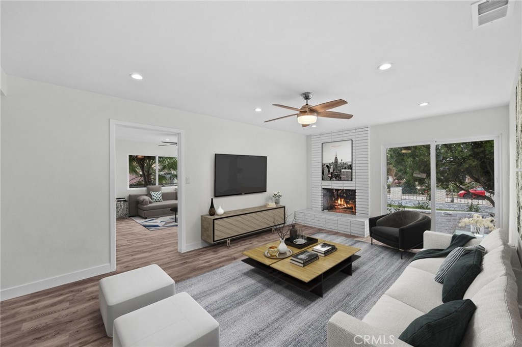 19404 Cheshire Street Rialto, CA 92377 - Photo 12 of 30 a living room with furniture and a flat screen tv