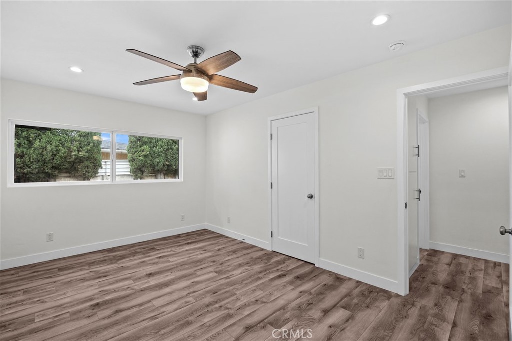 19404 Cheshire Street Rialto, CA 92377 - Photo 17 of 30 a view of empty room with wooden floor and fan