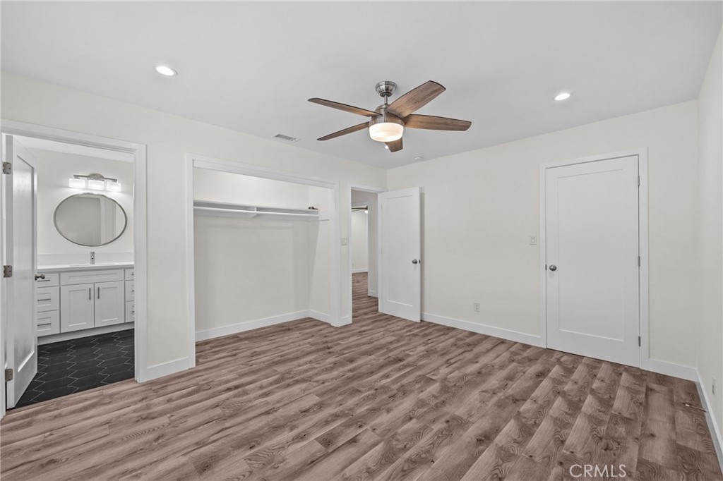 19404 Cheshire Street Rialto, CA 92377 - Photo 21 of 30 a view of an empty room and window wooden floor and cabinet