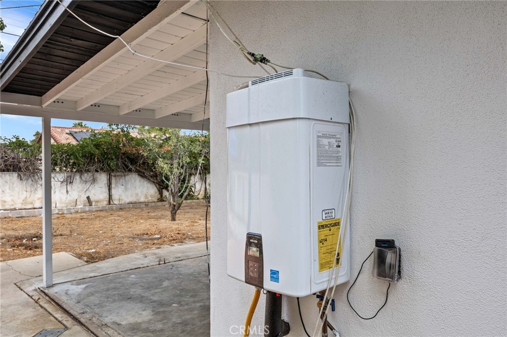 19404 Cheshire Street Rialto, CA 92377 - Photo 25 of 30 a bathroom with a granite countertop sink and a mirror