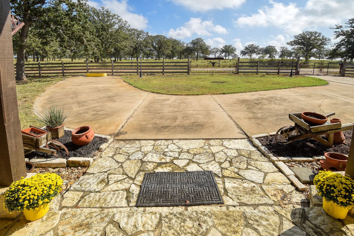8500 Rosanky Road Waelder, TX 78959 - Photo 11 of 40 a view of a swimming pool with a yard and plants