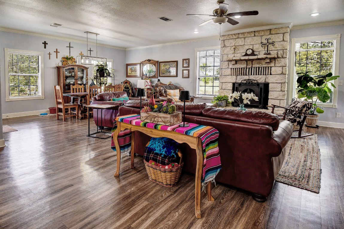 8500 Rosanky Road Waelder, TX 78959 - Photo 19 of 40 a living room with furniture and a fireplace