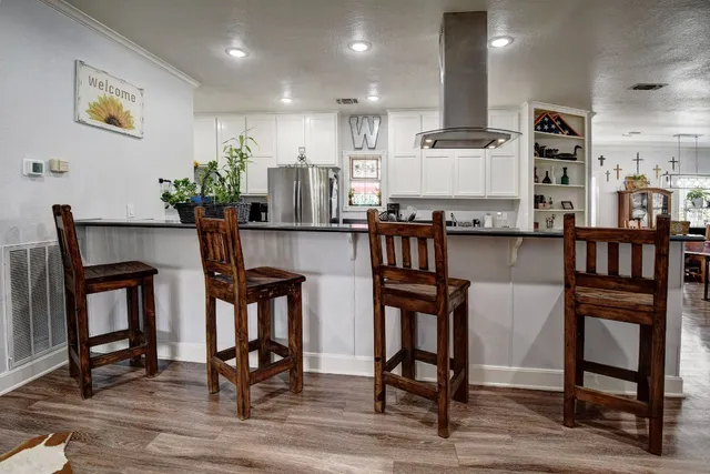 a view of kitchen with furniture and wooden floor