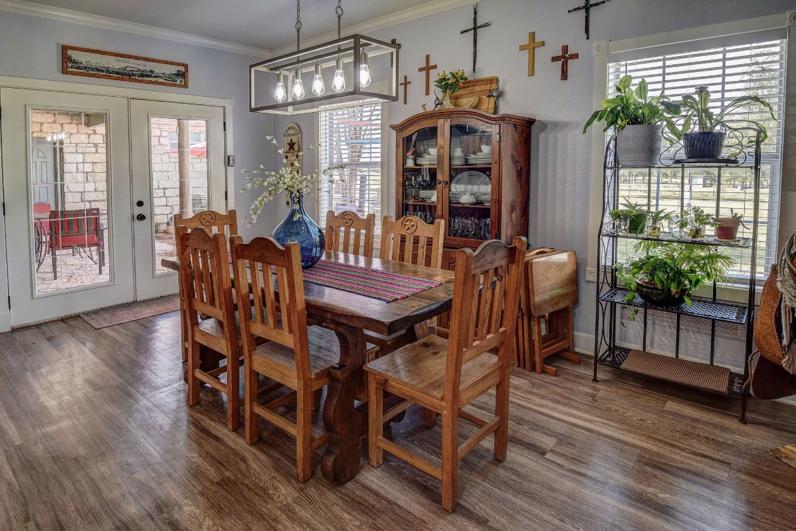 8500 Rosanky Road Waelder, TX 78959 - Photo 27 of 40 a view of a dining room with furniture window and wooden floor