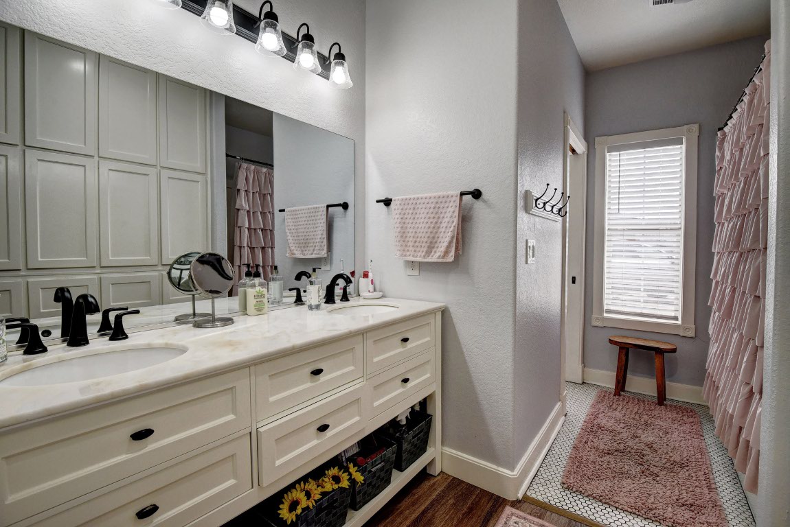 8500 Rosanky Road Waelder, TX 78959 - Photo 33 of 40 a bathroom with a sink double vanity and a mirror