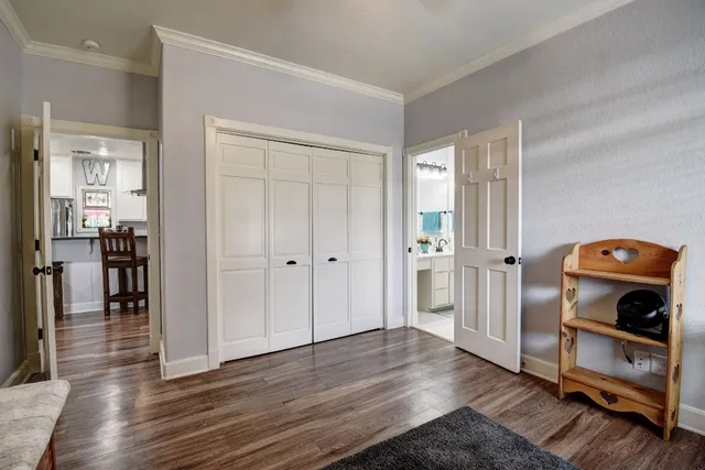 a view of a livingroom with wooden floor