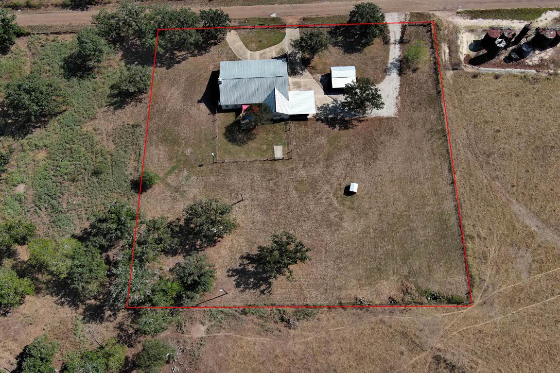 8500 Rosanky Road Waelder, TX 78959 - Photo 7 of 40 an aerial view of a house with outdoor space