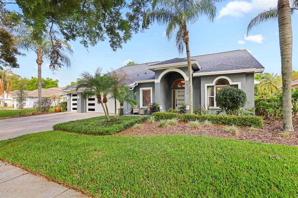 5208 Laurel Pointe Drive Valrico, FL 33596 - Photo 1 of 61 a front view of a house with garden