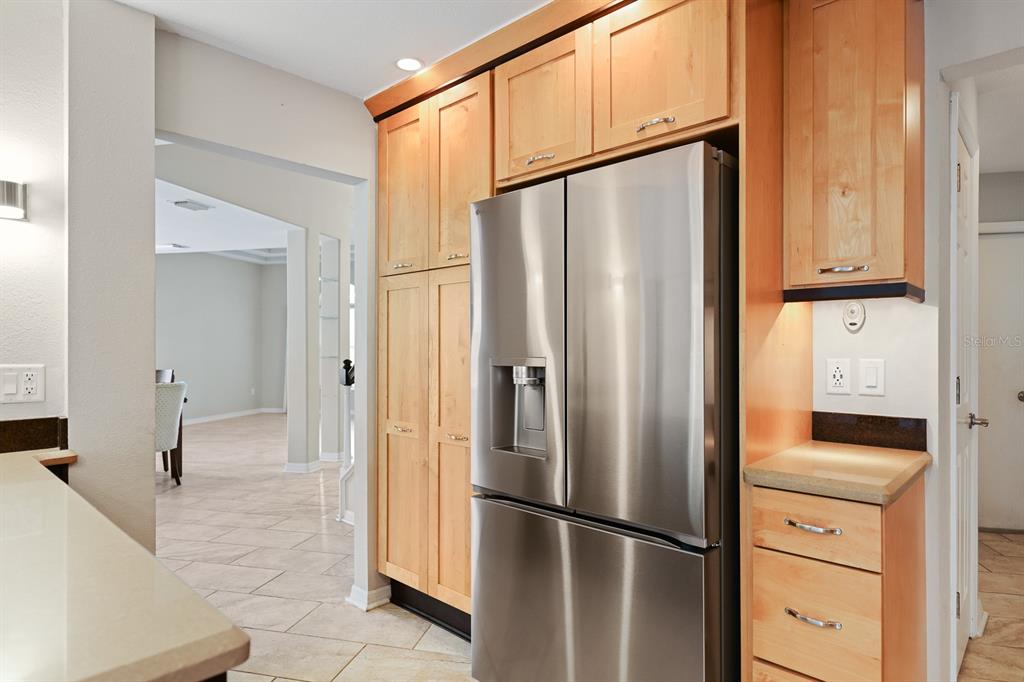 5208 Laurel Pointe Drive Valrico, FL 33596 - Photo 16 of 61 a kitchen with stainless steel appliances a refrigerator and cabinets
