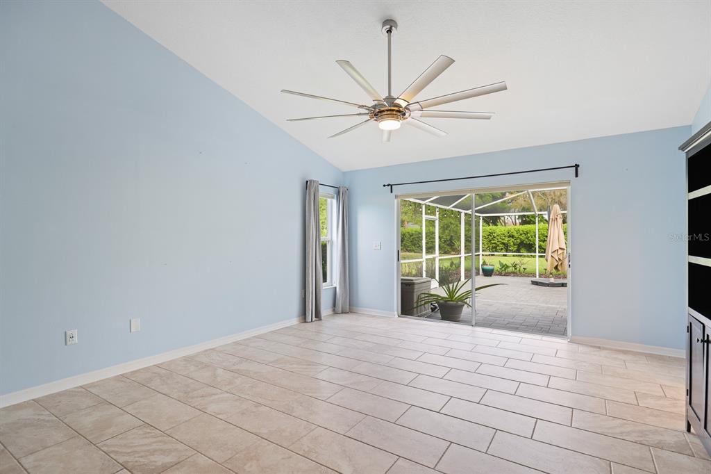 5208 Laurel Pointe Drive Valrico, FL 33596 - Photo 21 of 61 a bedroom with a large bed and a large window