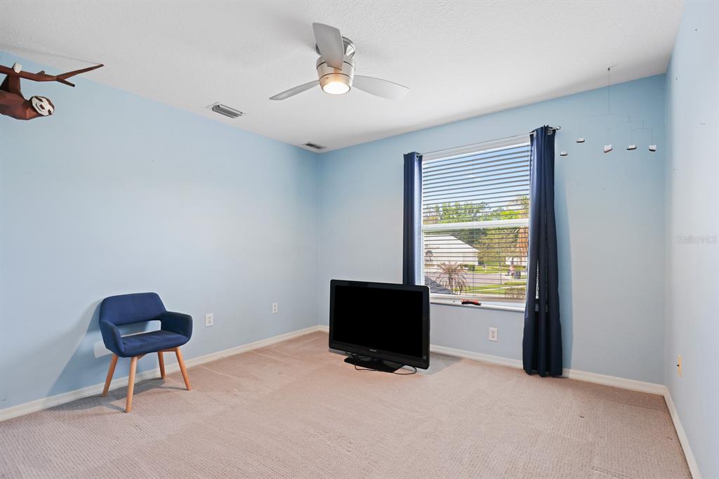 5208 Laurel Pointe Drive Valrico, FL 33596 - Photo 33 of 61 a living room with furniture and a window