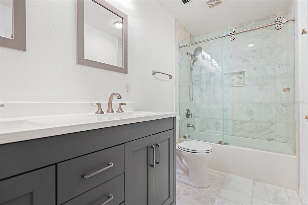 5208 Laurel Pointe Drive Valrico, FL 33596 - Photo 36 of 61 a bathroom with a sink a toilet and shower