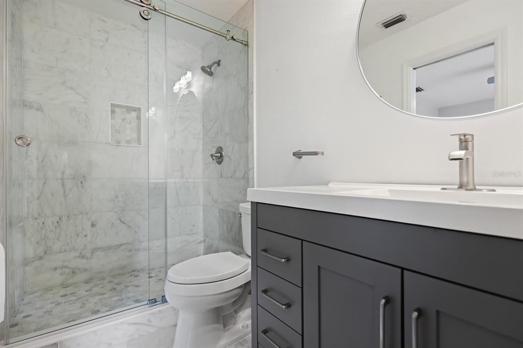 5208 Laurel Pointe Drive Valrico, FL 33596 - Photo 41 of 61 a bathroom with a sink a toilet and shower
