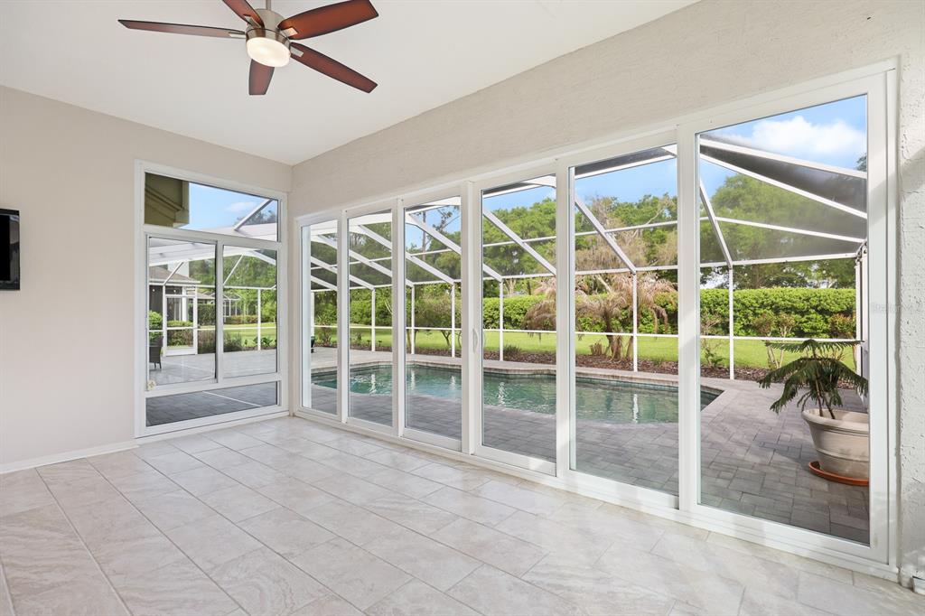 5208 Laurel Pointe Drive Valrico, FL 33596 - Photo 43 of 61 a view of a livingroom with a ceiling fan and a window