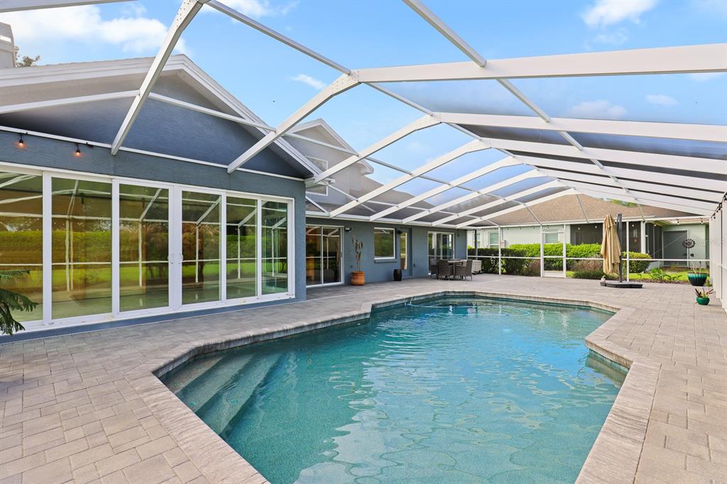 5208 Laurel Pointe Drive Valrico, FL 33596 - Photo 45 of 61 a view of a swimming pool with a patio