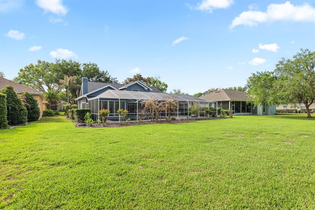 5208 Laurel Pointe Drive Valrico, FL 33596 - Photo 52 of 61 a front view of a house with garden