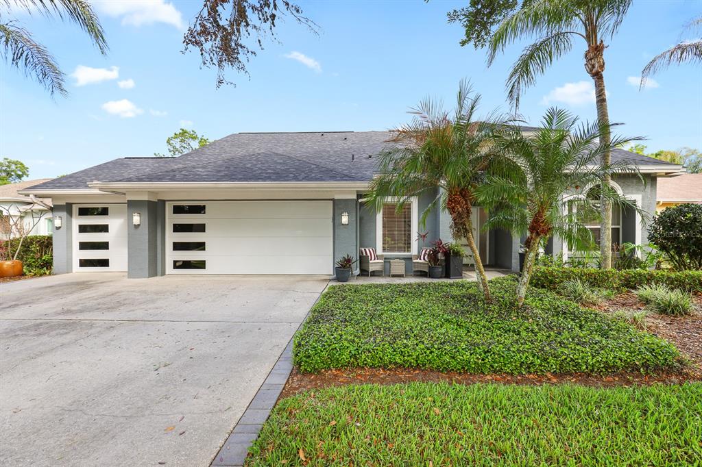 5208 Laurel Pointe Drive Valrico, FL 33596 - Photo 61 of 61 a front view of a house with a garden