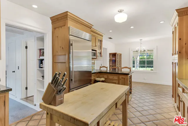a view of living room with furniture and a fireplace
