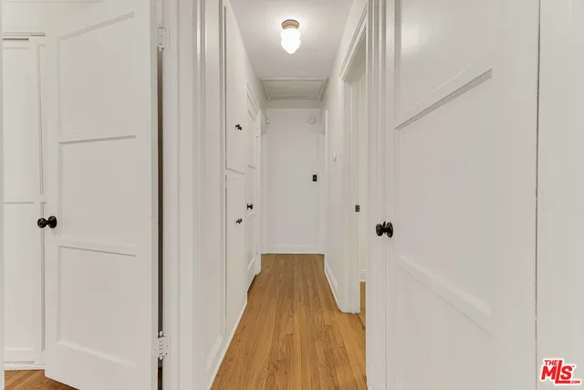 a spacious bathroom with a tub sink and mirror