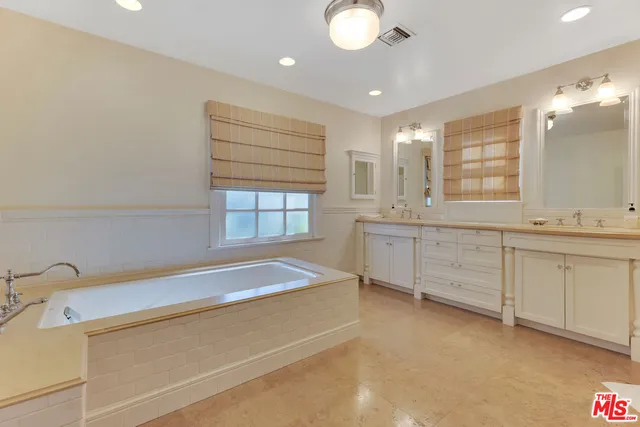 a bathroom with a large mirror