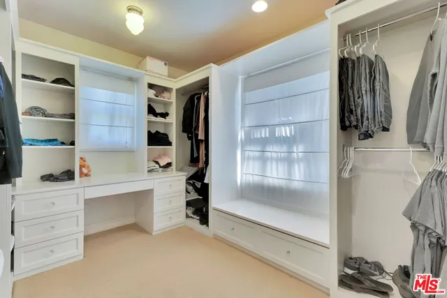 a view of an empty room and a fireplace