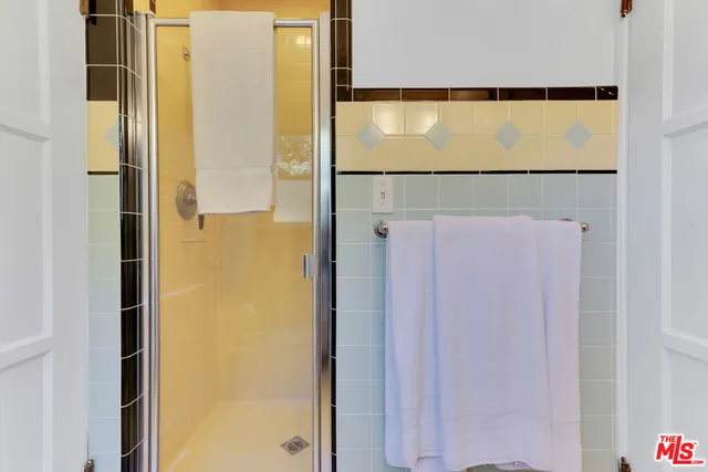 a pathway of a house with a yard