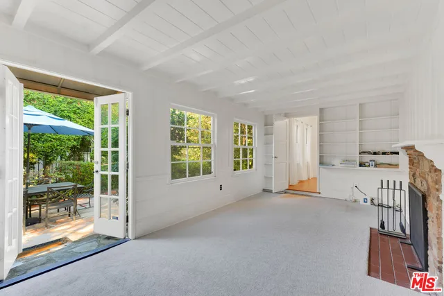 a patio with a patio table and chairs
