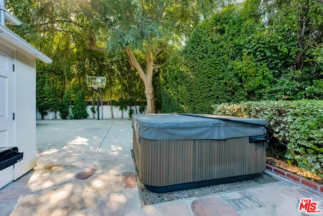 a view of a pathway of a house with a yard