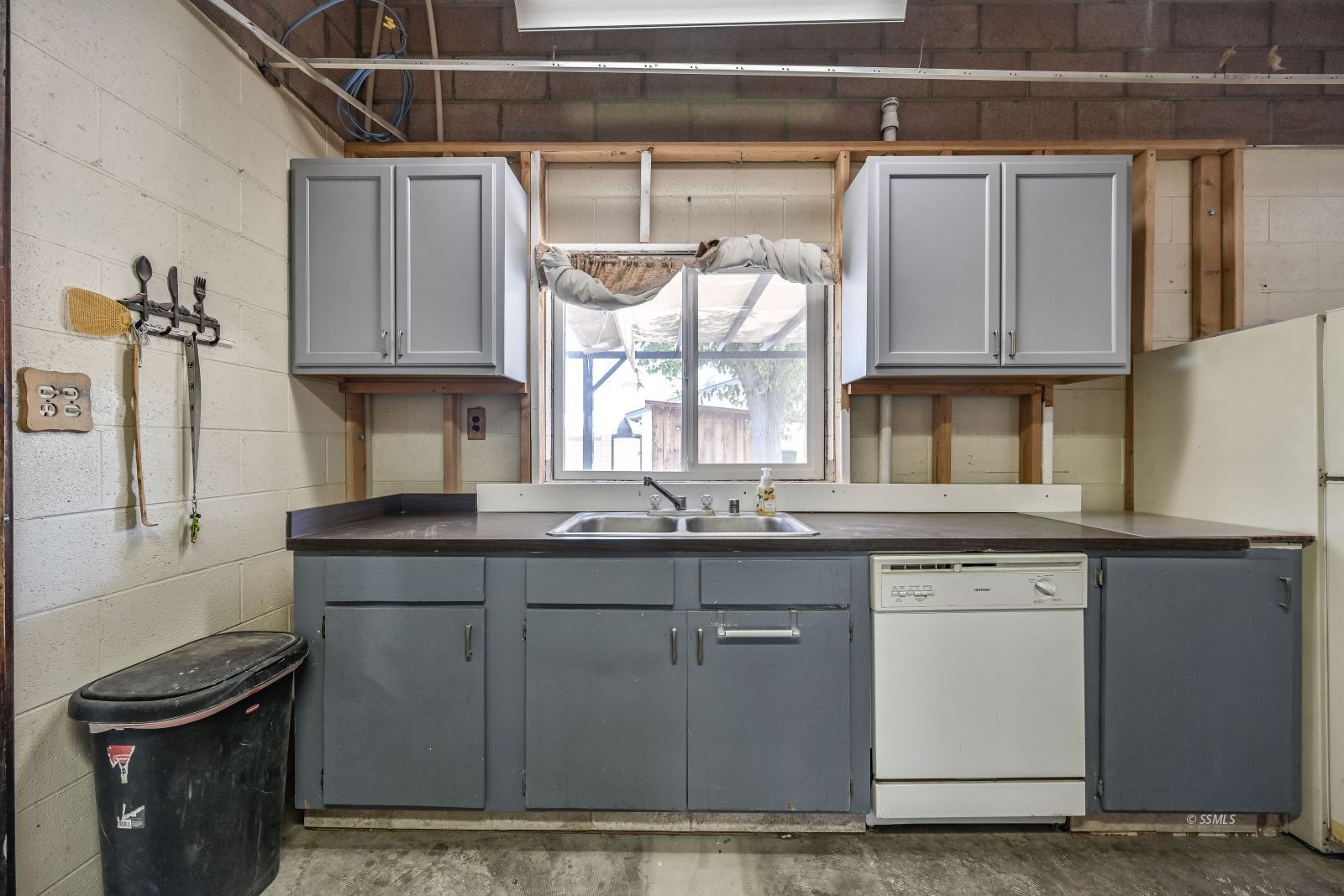 1572 North Calvert Boulevard Ridgecrest, CA 93555 - Photo 15 of 27 a kitchen with stainless steel appliances granite countertop a sink and a stove