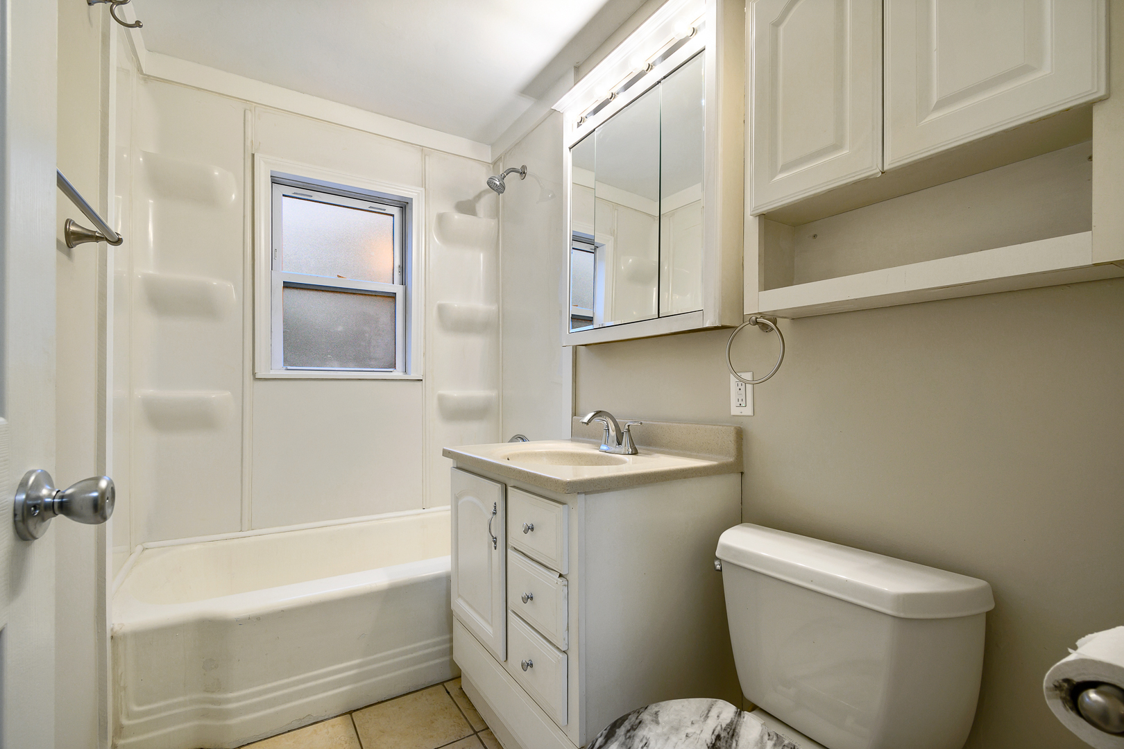 235 West Hickory Road Lombard, IL 60148 - Photo 11 of 23 a bathroom with a granite countertop toilet a sink and bathtub