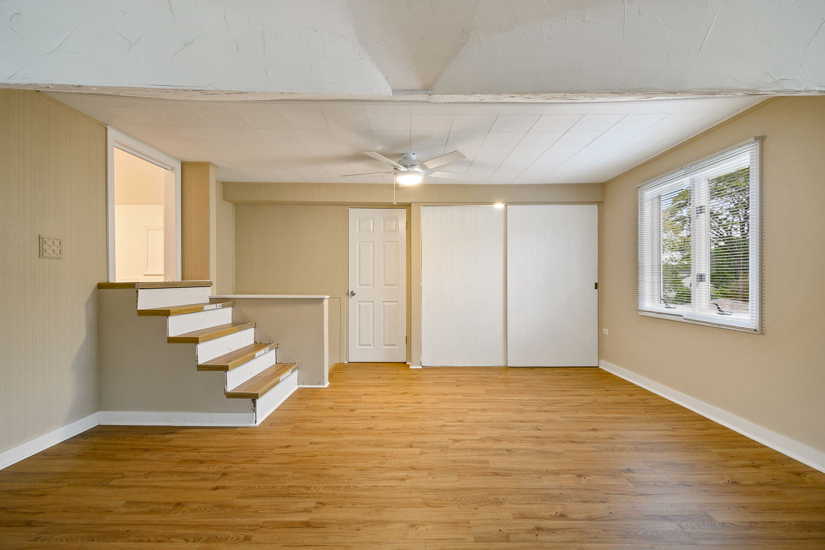 235 West Hickory Road Lombard, IL 60148 - Photo 14 of 23 a view of an empty room with wooden floor and a window