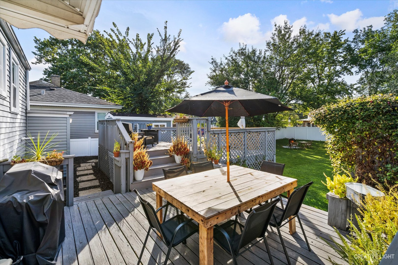 235 West Hickory Road Lombard, IL 60148 - Photo 20 of 23 a view of a dinning table and chairs on the roof deck