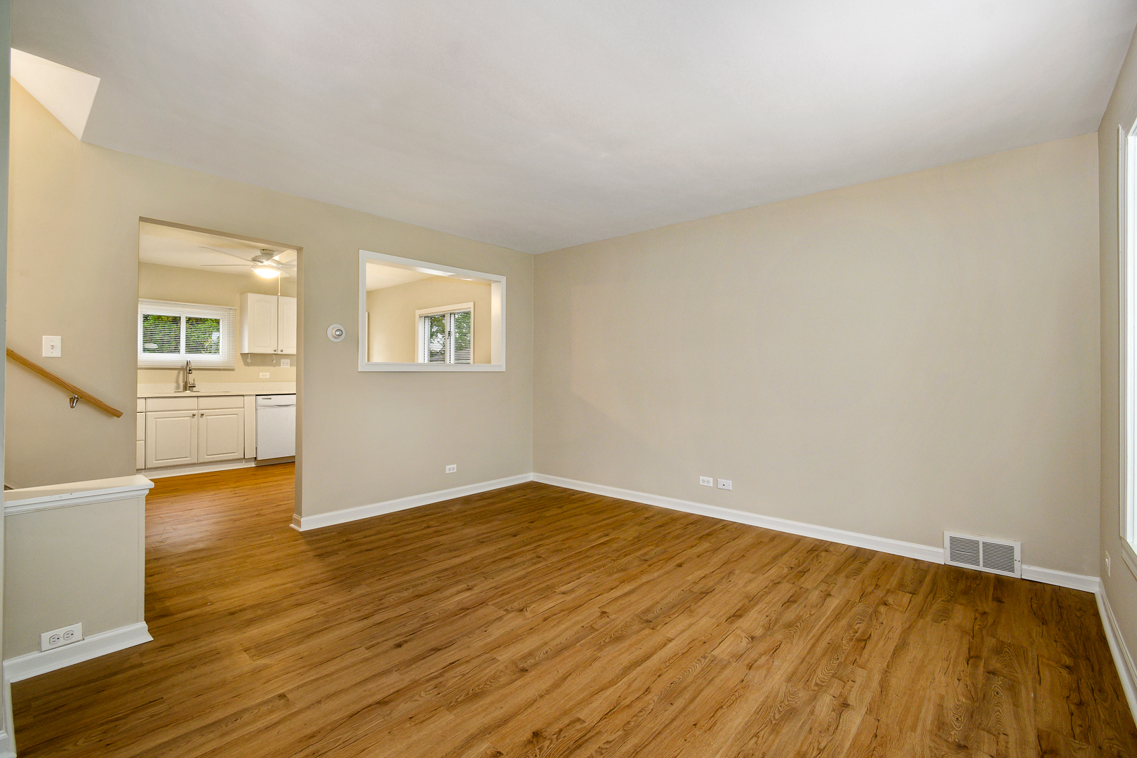 235 West Hickory Road Lombard, IL 60148 - Photo 5 of 23 an empty room with wooden floor and windows