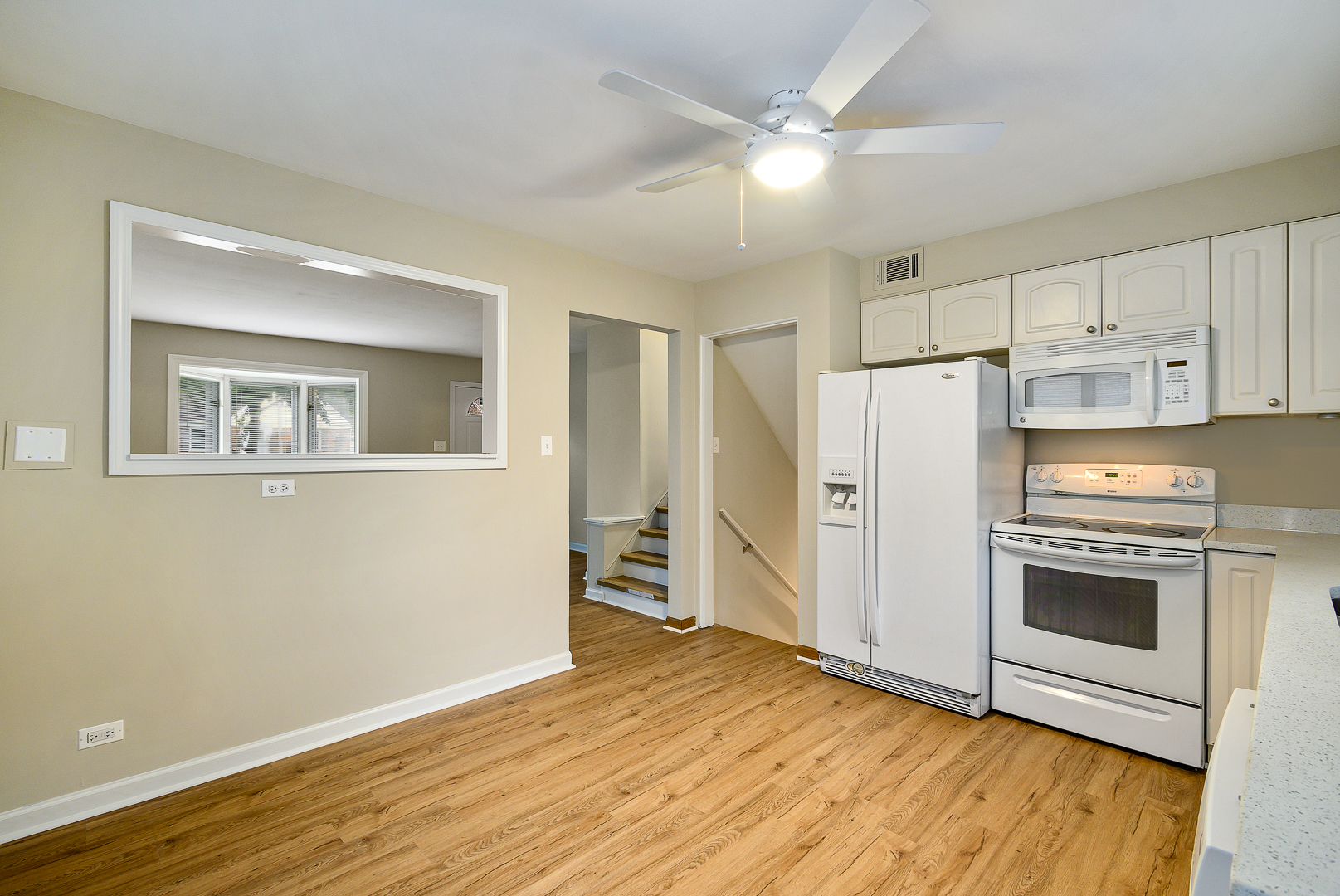235 West Hickory Road Lombard, IL 60148 - Photo 6 of 23 a kitchen with white cabinets and white appliances