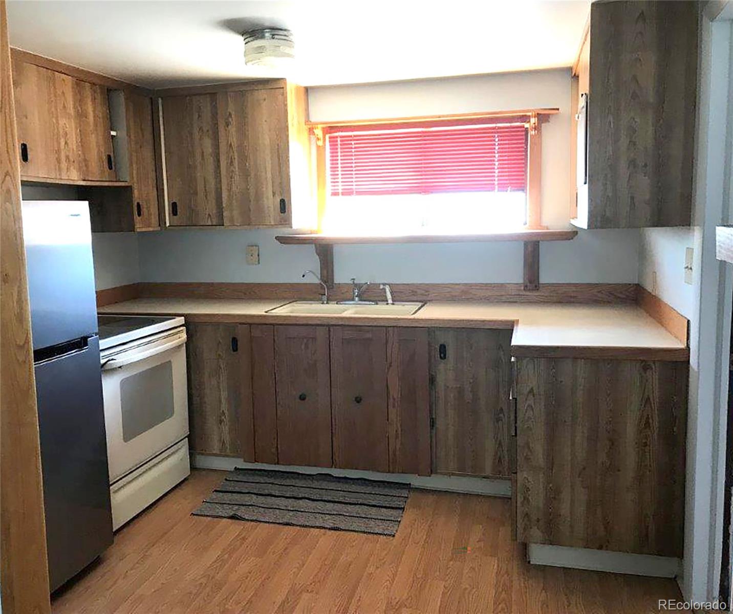 354 Neal Road Bailey, CO 80421 - Photo 4 of 19 a kitchen with stainless steel appliances a sink dishwasher a refrigerator and cabinets