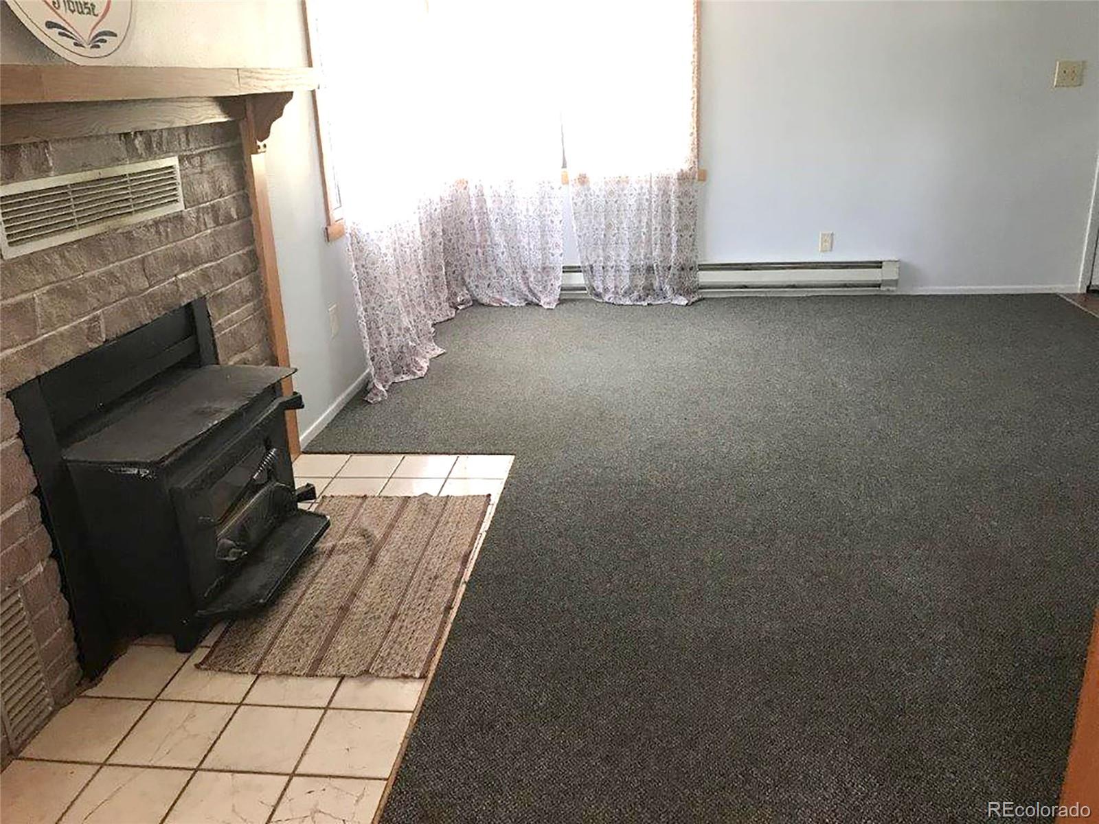 354 Neal Road Bailey, CO 80421 - Photo 5 of 19 a view of a furniture in an empty room