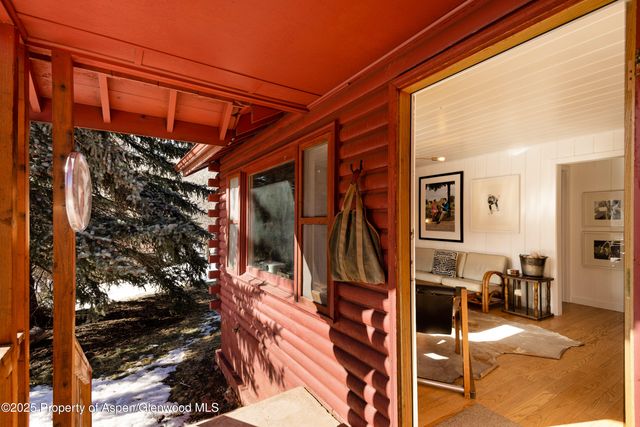 a view of a hallway with washer and dryer