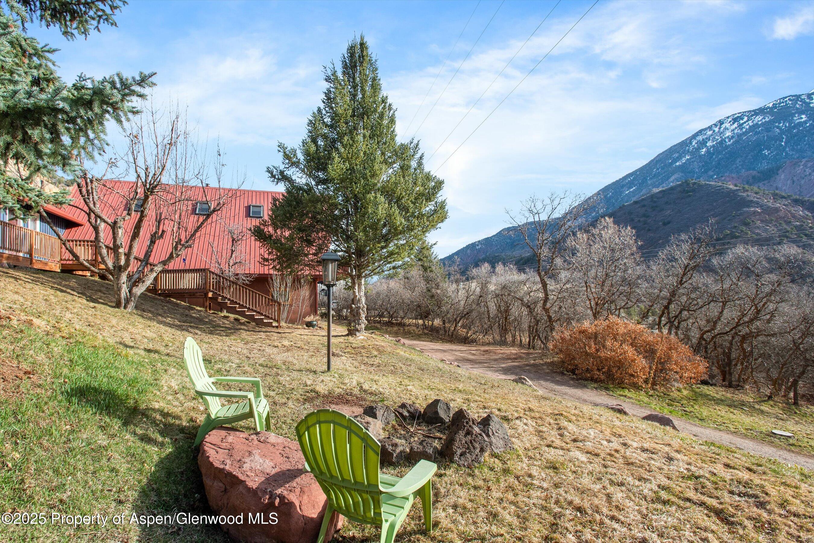 189 Ute Trail Carbondale, CO 81623 - Photo 21 of 76 a backyard of a house with table and chairs