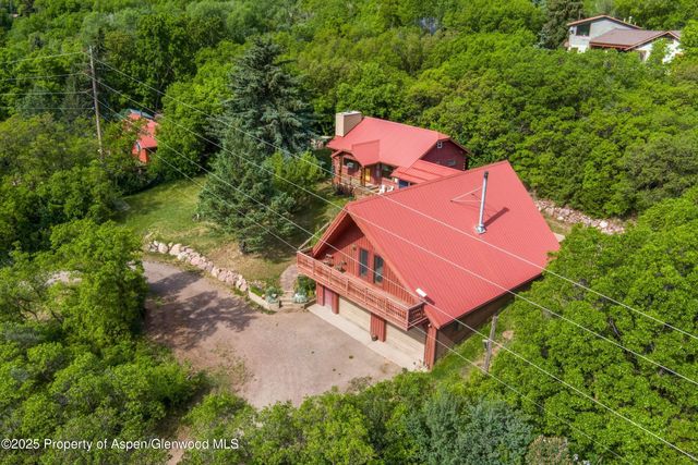 a view of a livingroom with furniture and workspace