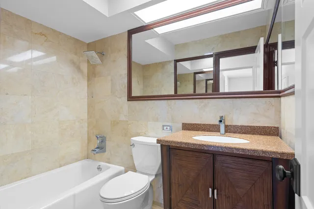 a bathroom with a sink a toilet and a bathtub