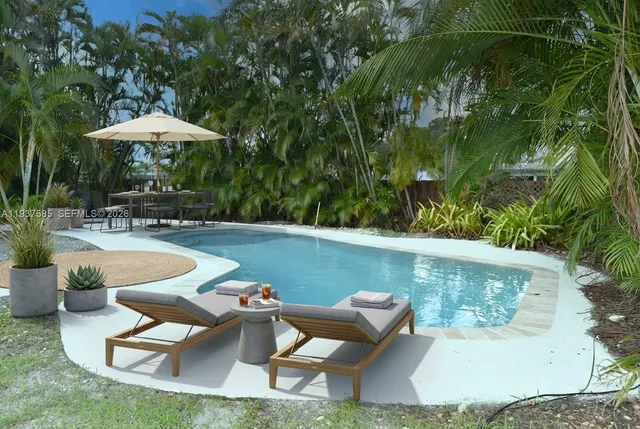 a view of a swimming pool with a patio