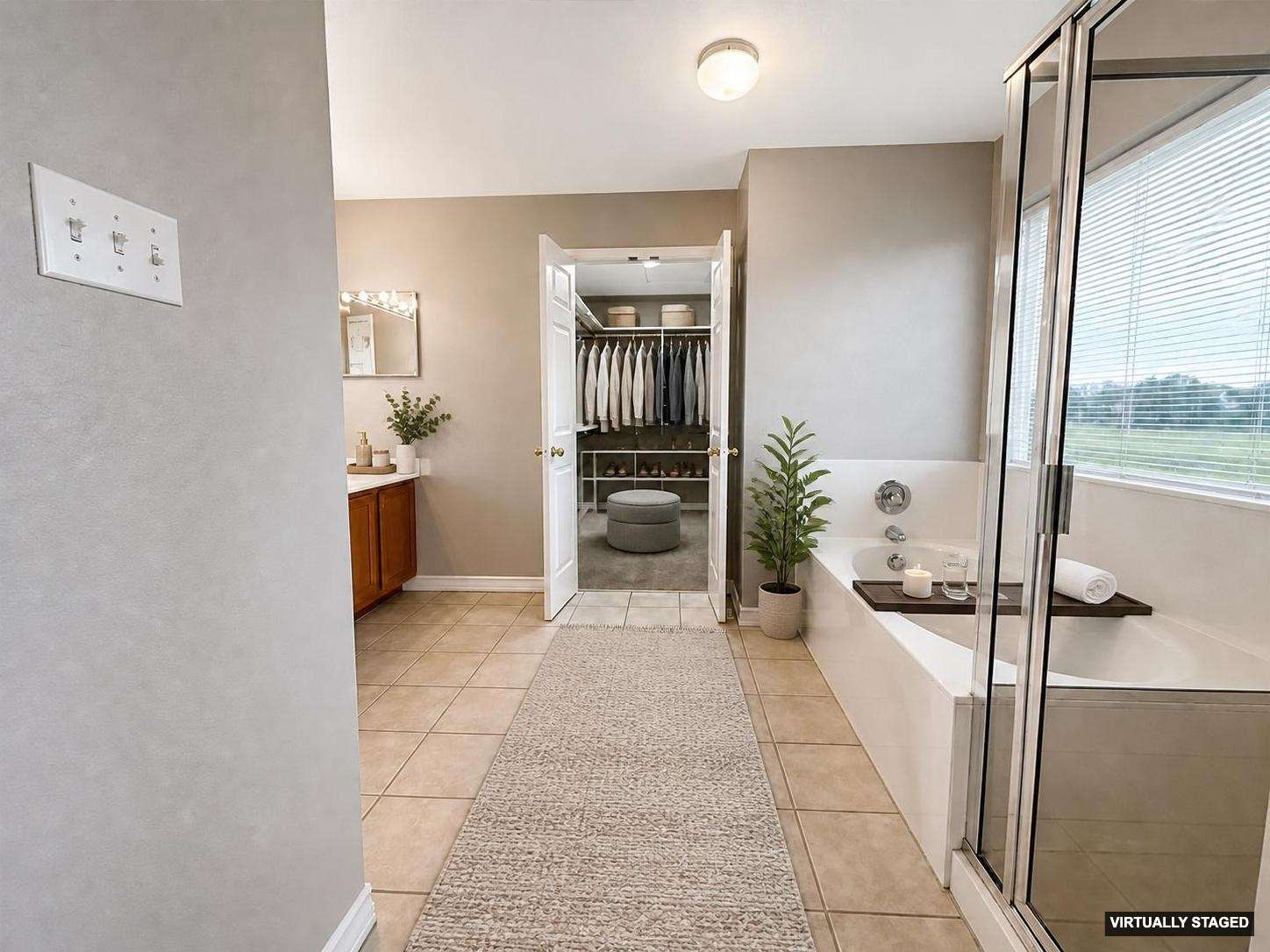 14828 Single Trace Austin, TX 78728 - Photo 16 of 30 Bathroom featuring a built-in soaking tub and an adjacent glass-enclosed shower