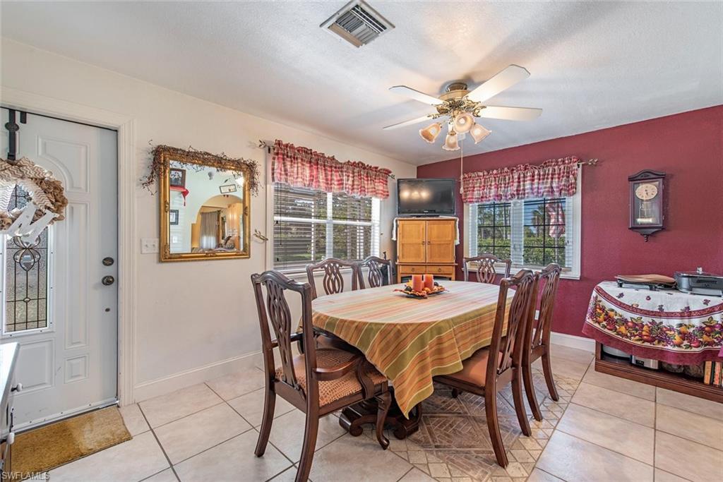 278 Sabal Palm Road Naples, FL 34114 - Photo 4 of 12 a dining room with furniture and window