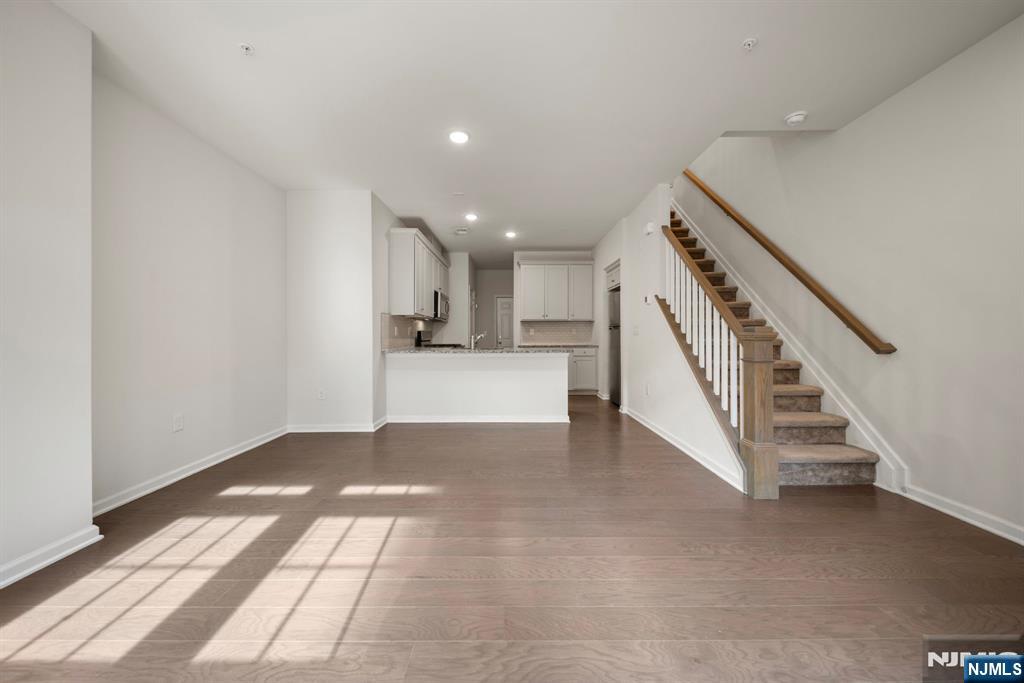 69 Arnold Drive, Unit 5810 Wood-Ridge, NJ 07075 - Photo 12 of 45 a view of entryway and hall with wooden floor